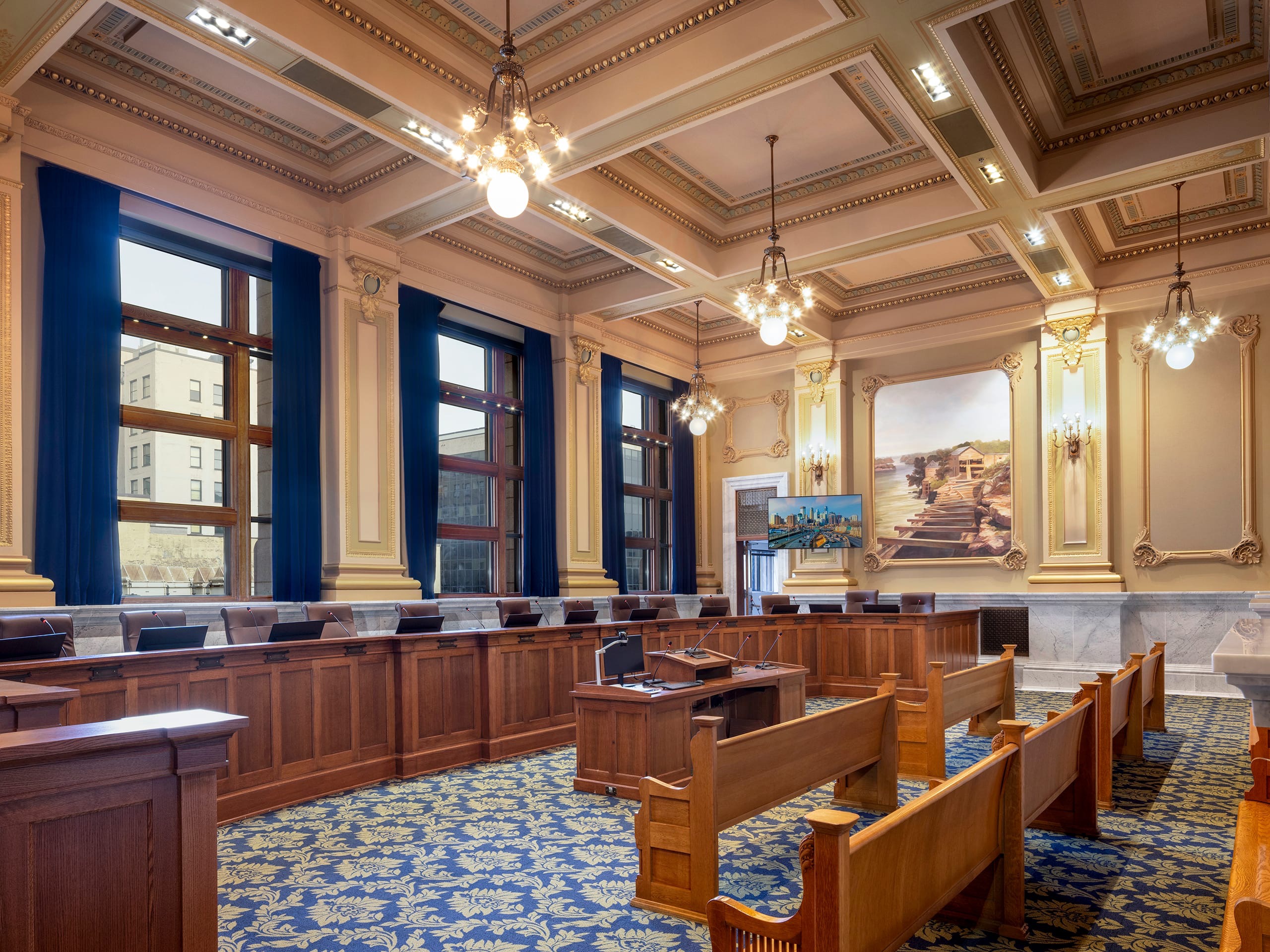 Minneapolis civic chamber with integrated displays, delegate microphones, and historic detailing