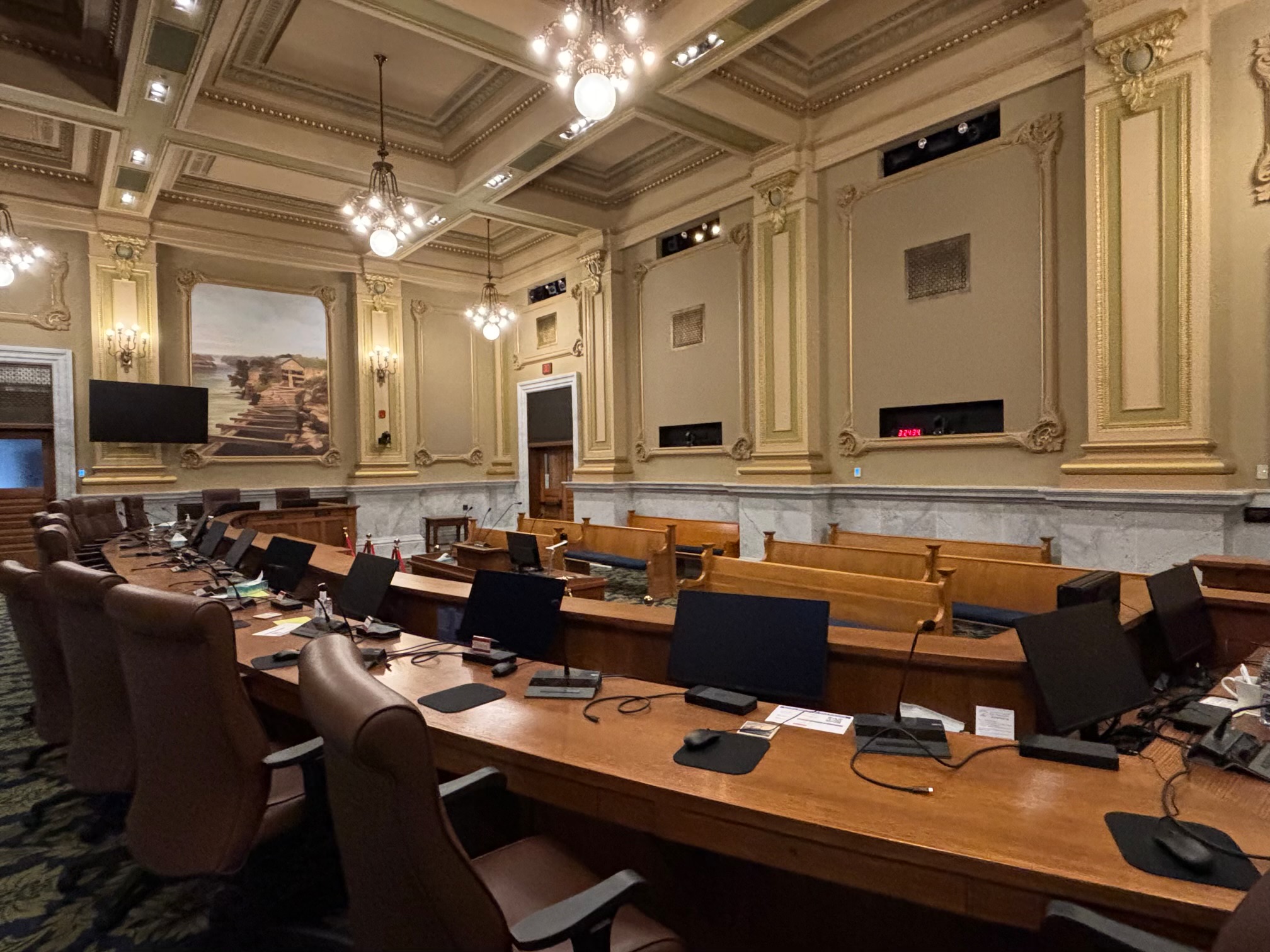 Minneapolis civic chamber with delegate microphones and integrated displays